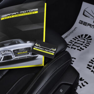 Zdjęcie gadżetów reklamowych na fotelu samochodu dla firmy German Motors